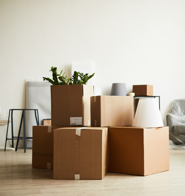 Stacked moving boxes ready for relocation.