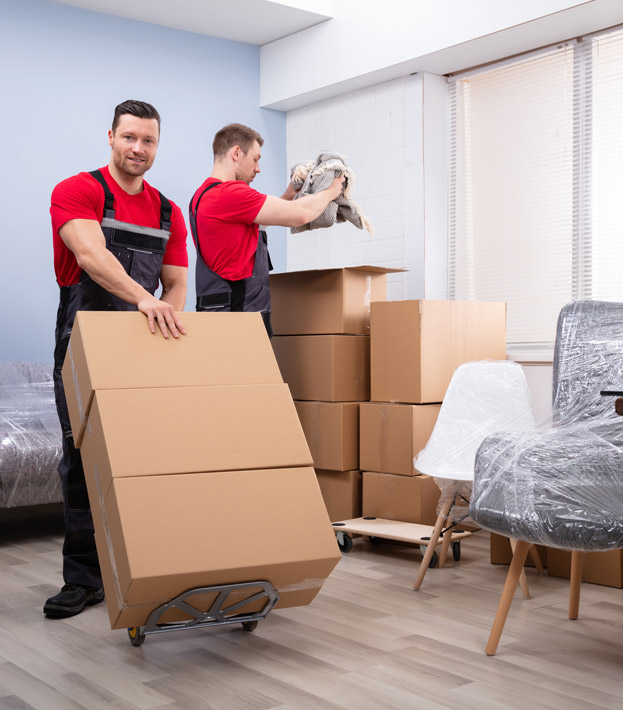 Professional movers discussing furniture placement.