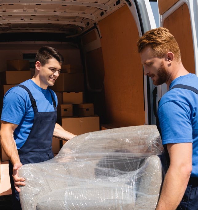 Professional movers unloading moving boxes from a moving van.