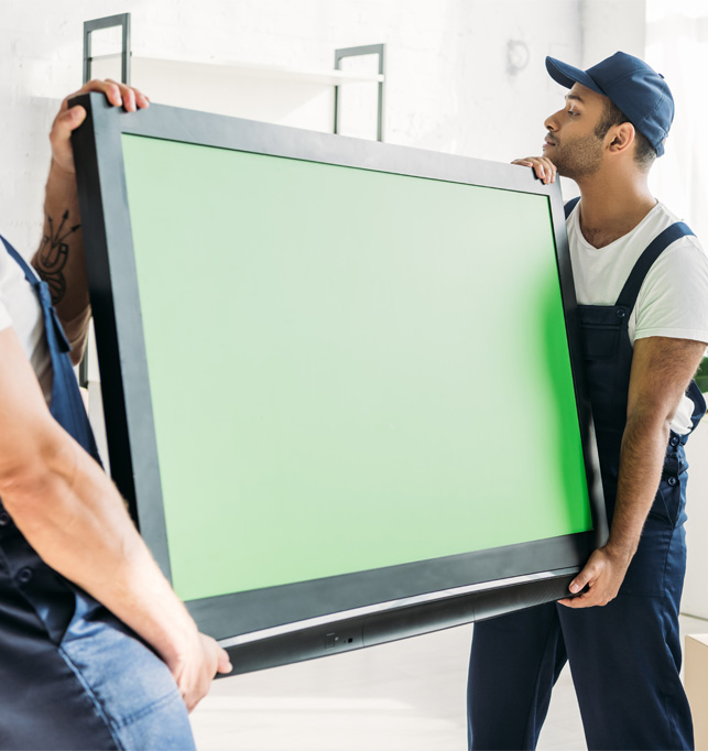 Professional movers carrying a large panel together.