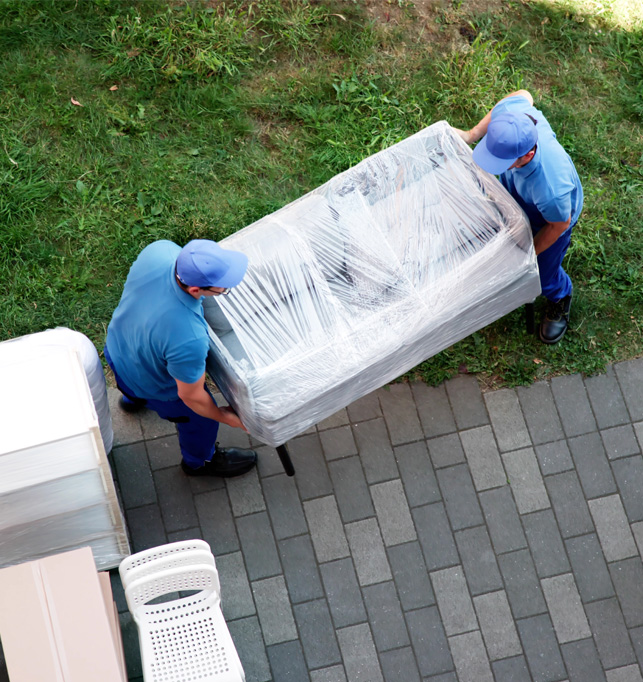 Professional movers carrying a large piece of furniture.