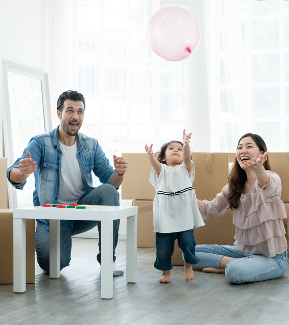 Happy family celebrating in their new home.