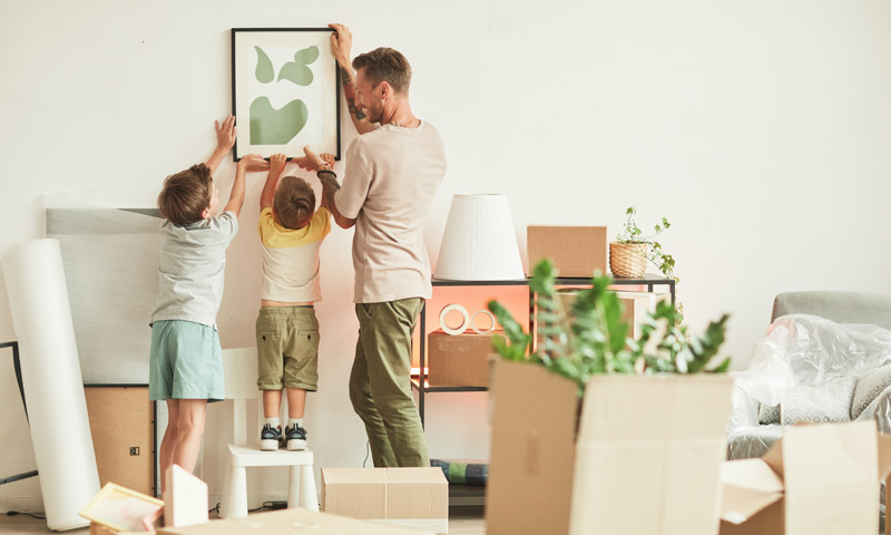 Happy family decorating their new home.